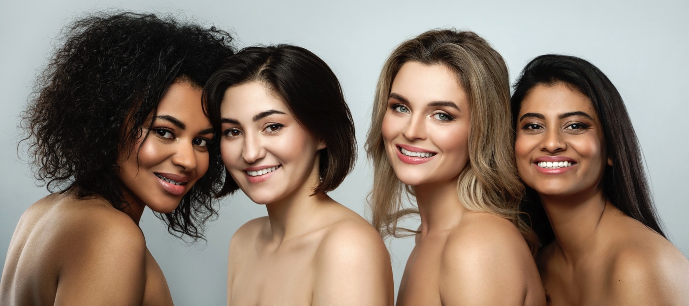 Photo of four woman with beautiful clear skin.